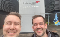 People standing in front of the Edinburgh university